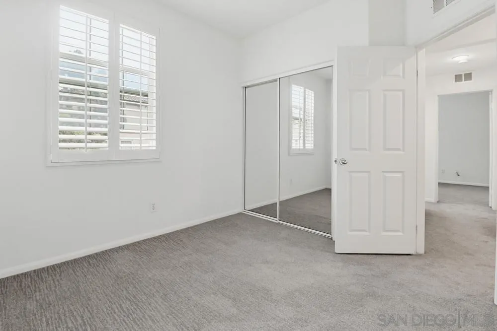 1293 Fools Gold Way, Unit 3 Chula Vista, CA 91913 - Photo 22 of 28 an empty room with windows