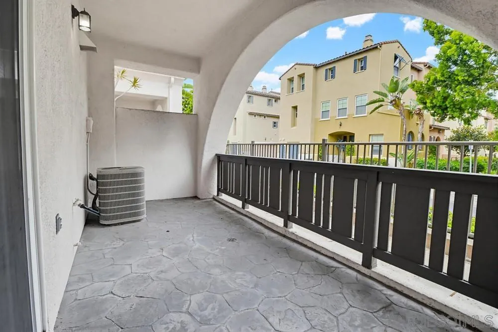 1293 Fools Gold Way, Unit 3 Chula Vista, CA 91913 - Photo 26 of 28 a view of a balcony with stairs and wooden floor