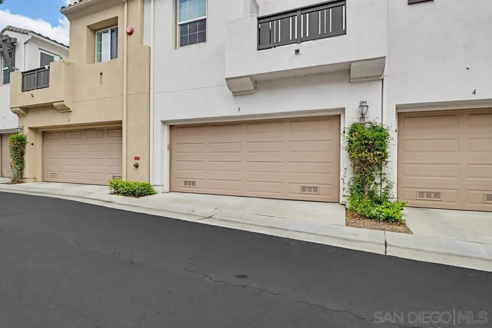 1293 Fools Gold Way, Unit 3 Chula Vista, CA 91913 - Photo 28 of 28 a front view of a house with a garage