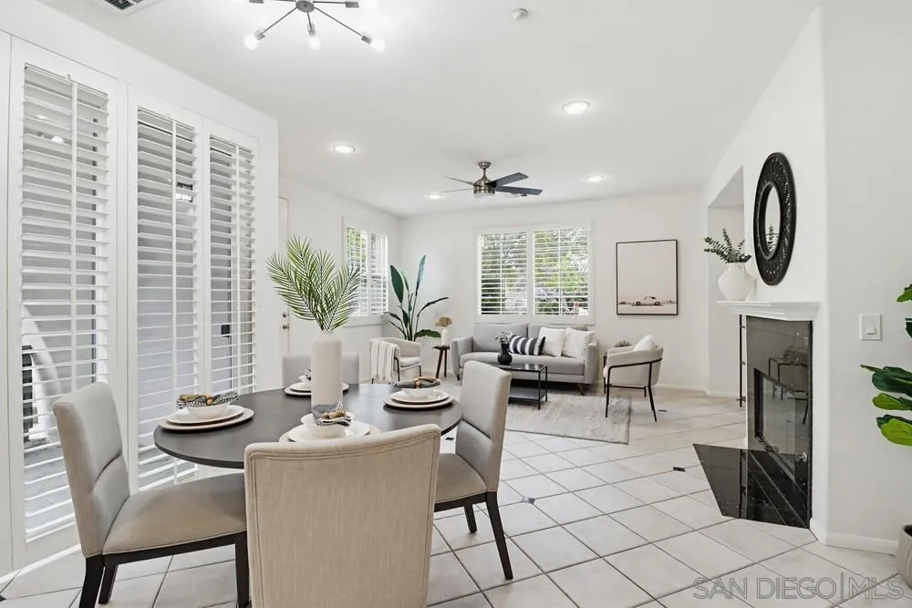 1293 Fools Gold Way, Unit 3 Chula Vista, CA 91913 - Photo 3 of 28 a view of a dining room with furniture window and wooden floor