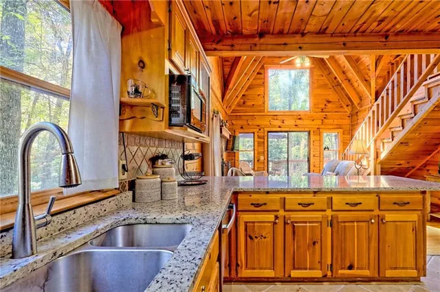 a kitchen with a sink and a window