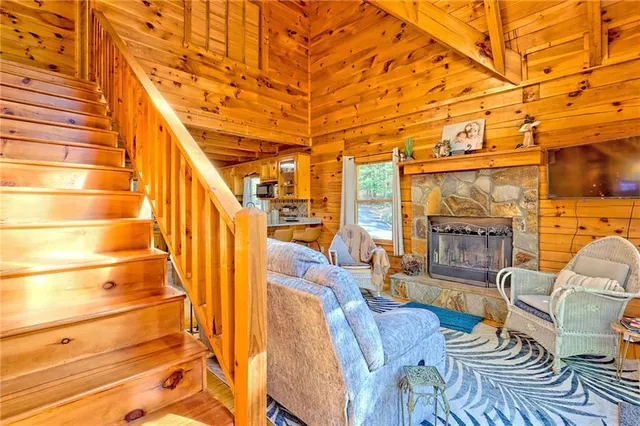 a outdoor living space with patio furniture and a fireplace