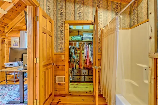 a view of a bathroom with a glass door