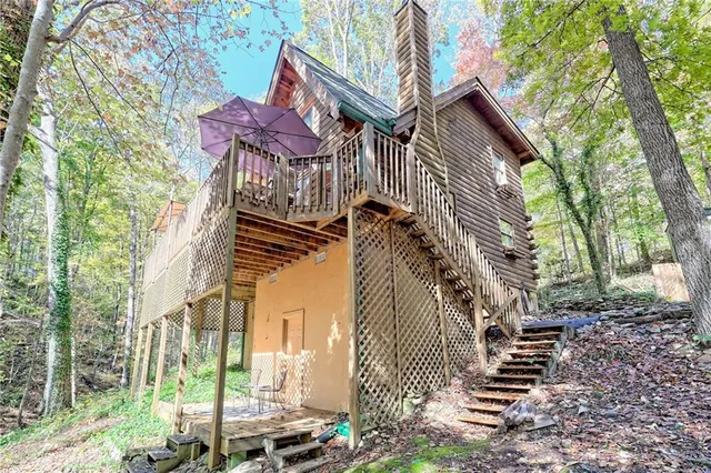 a view of a house with a tree