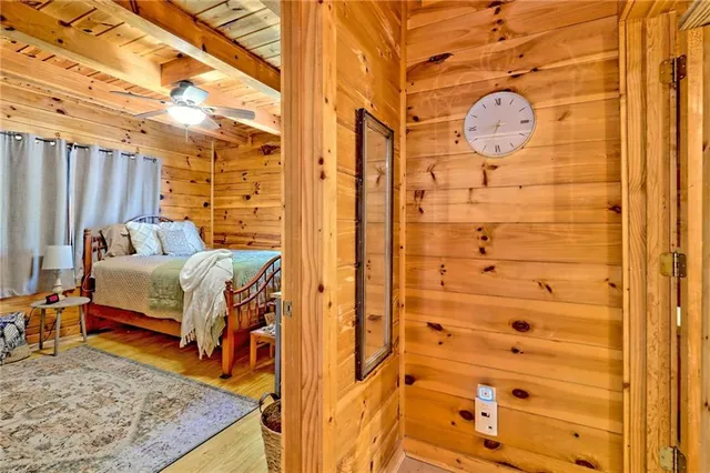 a bed room with a bed and a mirror