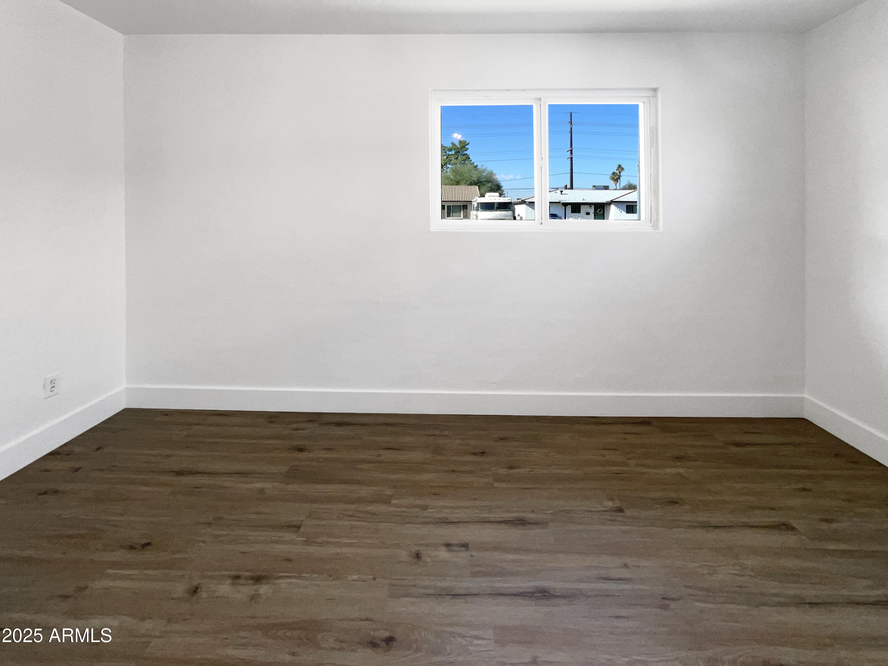 7231 North 23rd Avenue Phoenix, AZ 85021 - Photo 16 of 28 a view of a room with wooden floor and a window