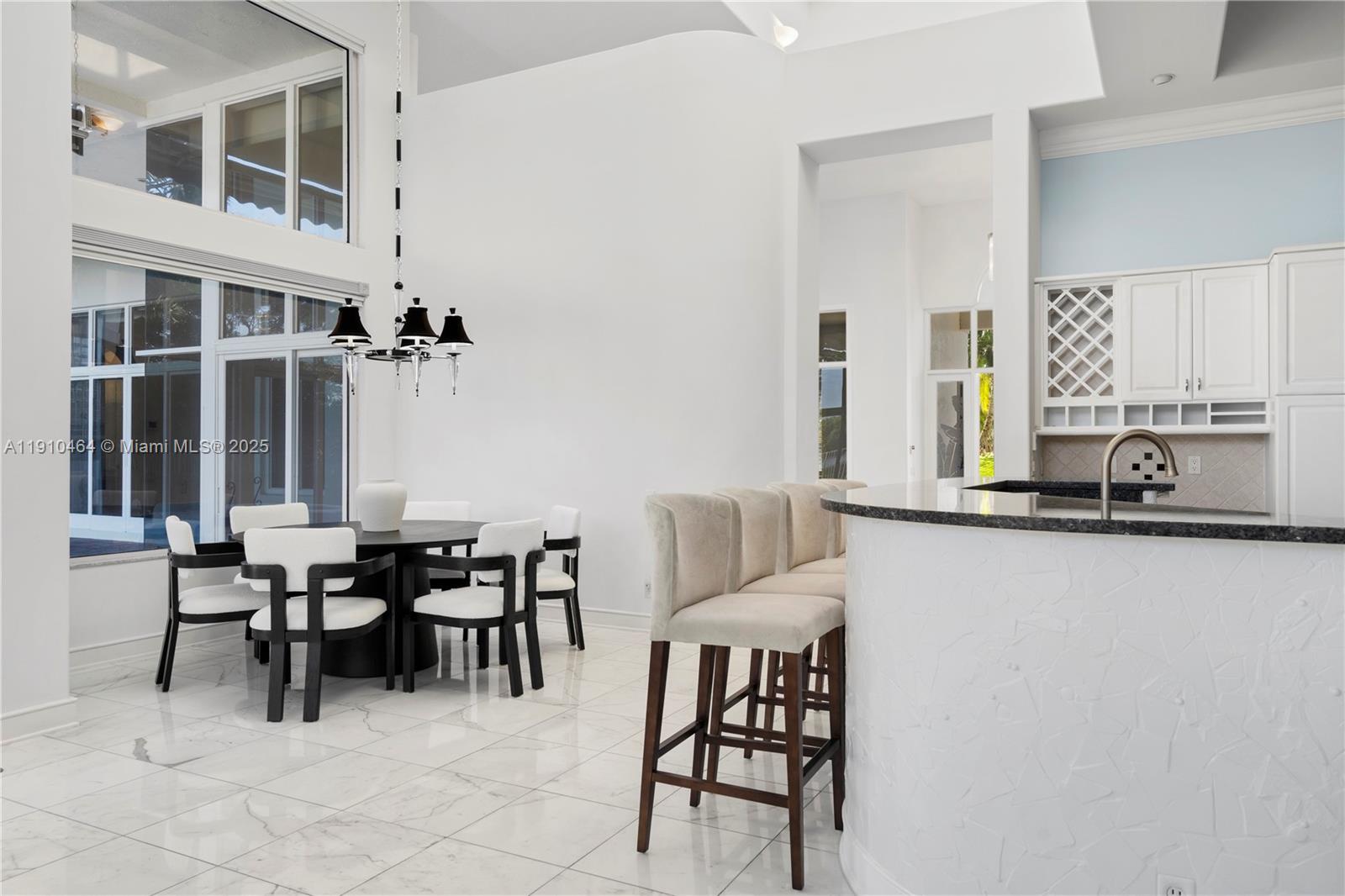 2939 Paddock Lane Weston, FL 33331 - Photo 13 of 59 a view of a dining room with furniture and window