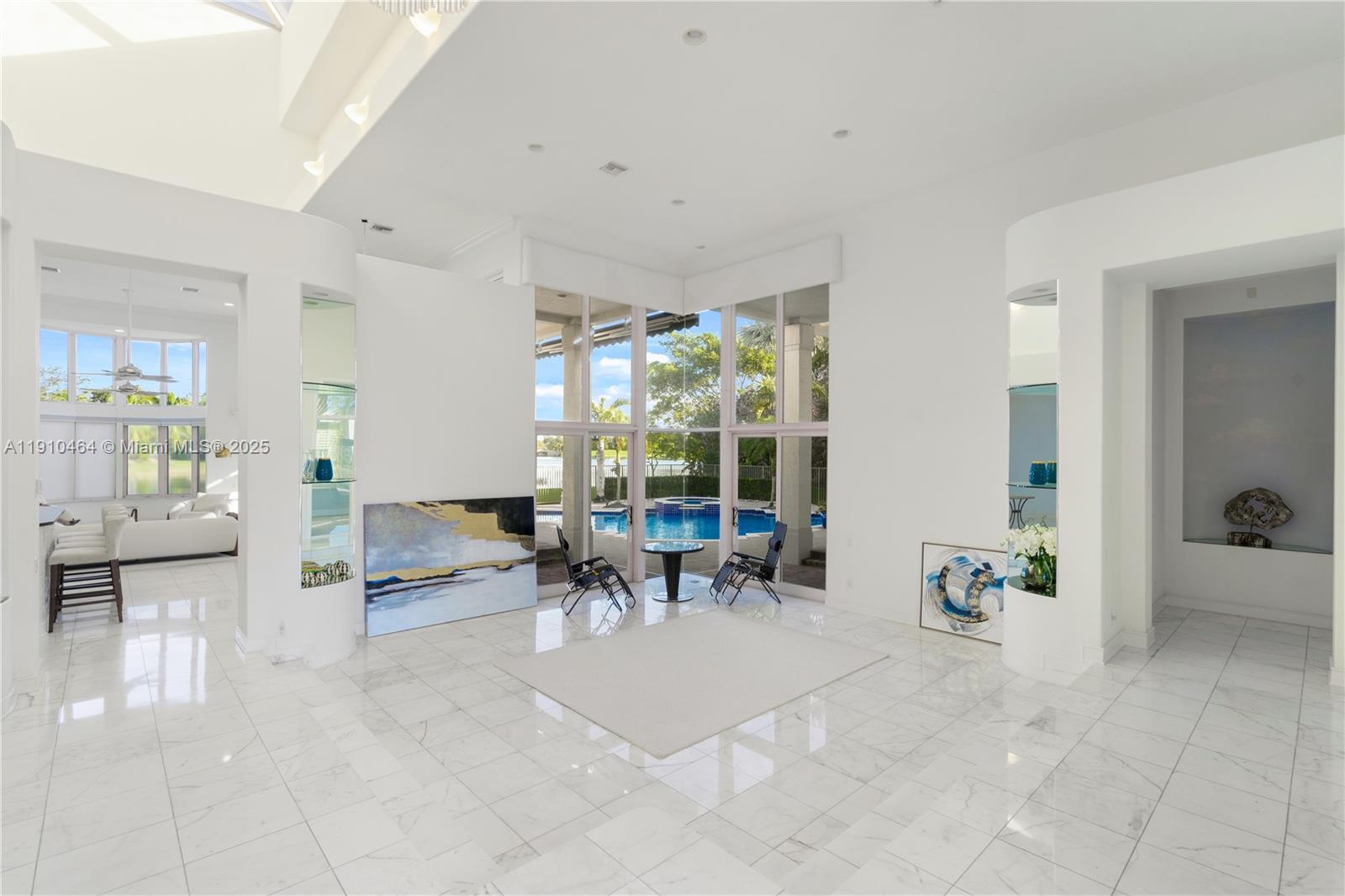 2939 Paddock Lane Weston, FL 33331 - Photo 18 of 59 a view of a lobby with furniture and floor to ceiling window