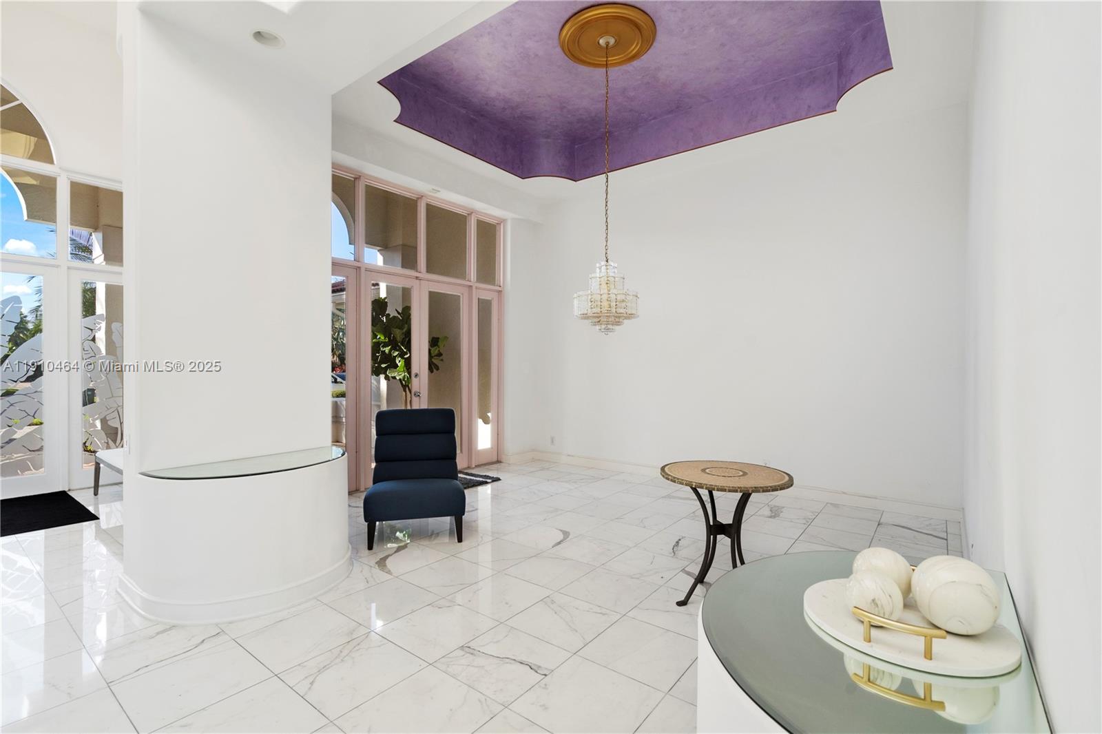 2939 Paddock Lane Weston, FL 33331 - Photo 24 of 59 a living room with furniture and a chandelier