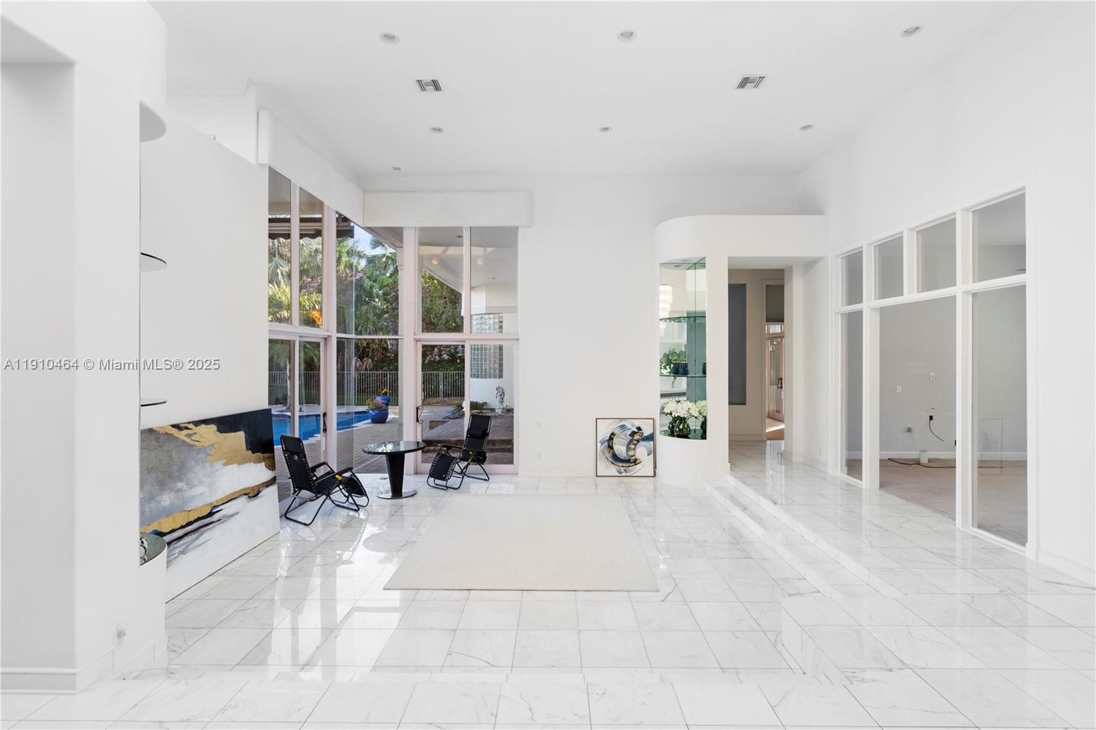 2939 Paddock Lane Weston, FL 33331 - Photo 27 of 59 a lobby with furniture and large windows