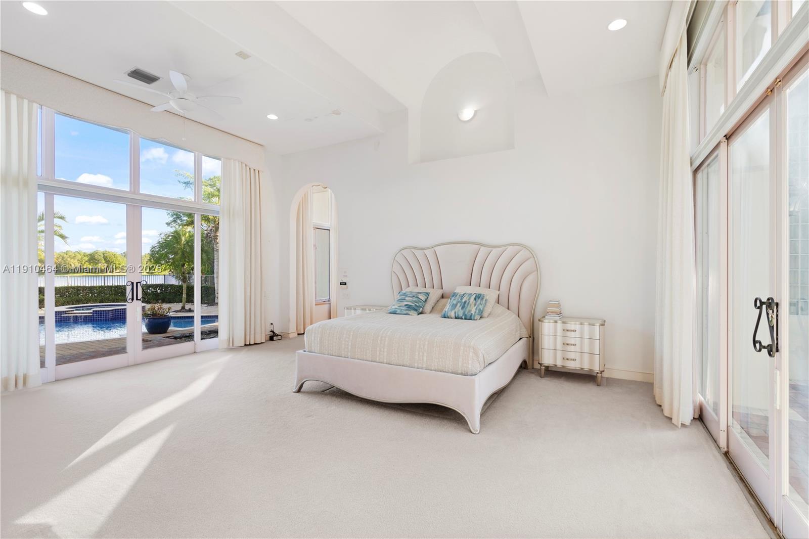 2939 Paddock Lane Weston, FL 33331 - Photo 31 of 59 a spacious bedroom with a bed and a large window
