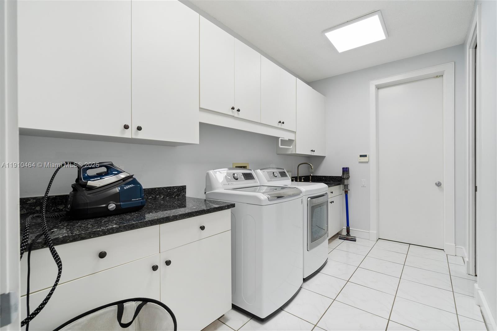 2939 Paddock Lane Weston, FL 33331 - Photo 46 of 59 a view of a kitchen with sink and cabinets