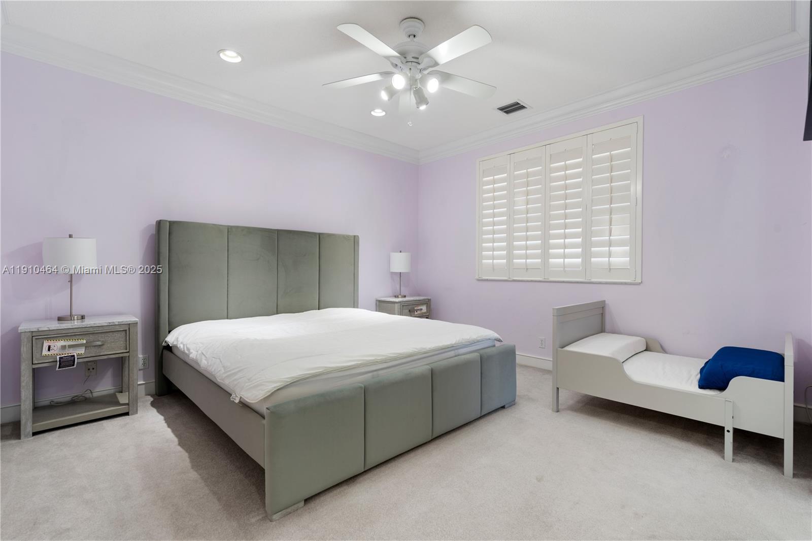 2939 Paddock Lane Weston, FL 33331 - Photo 50 of 59 a bedroom with a bed and a chandelier