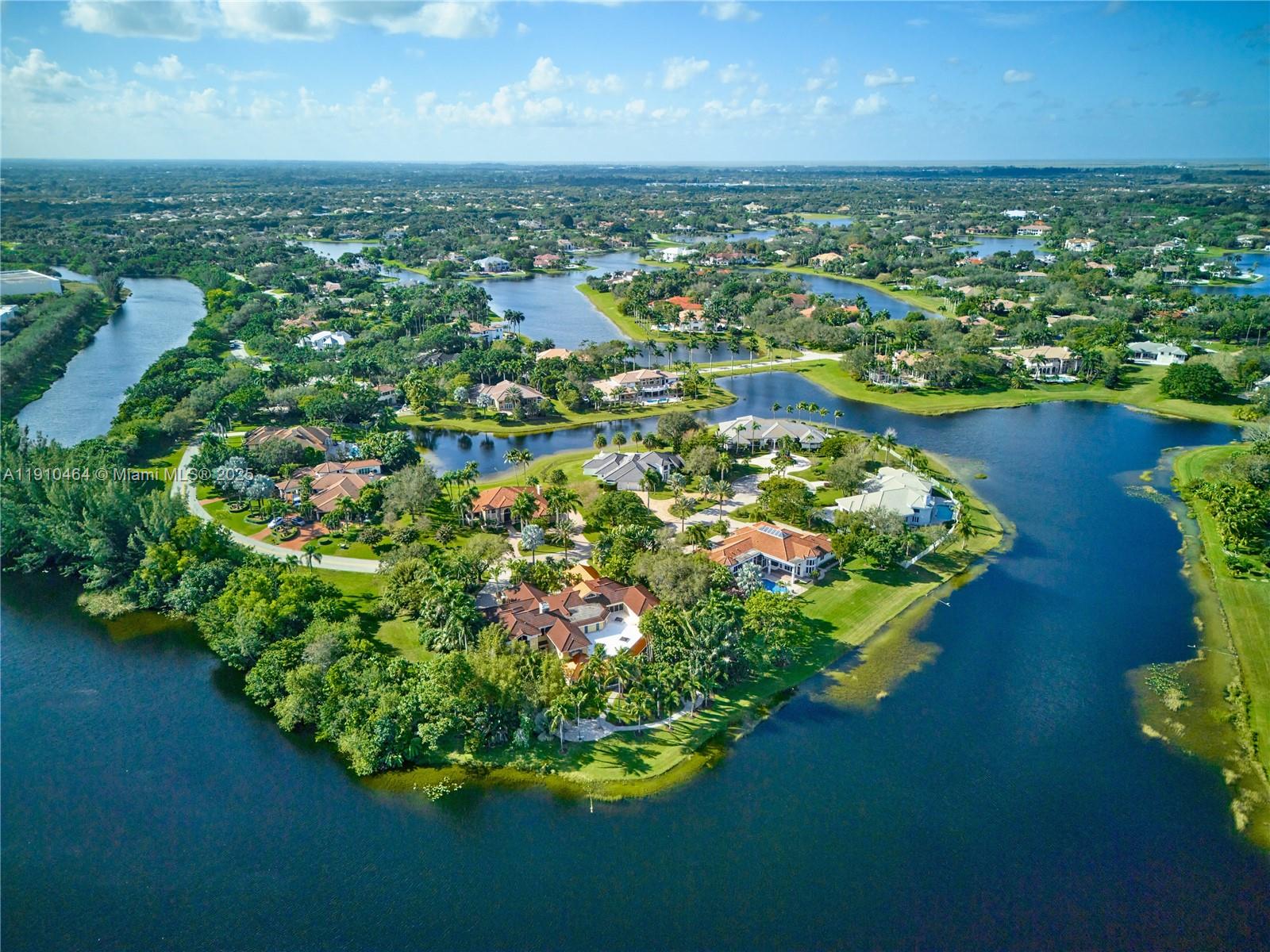 2939 Paddock Lane Weston, FL 33331 - Photo 5 of 59 an aerial view of residential houses with outdoor space and lake view