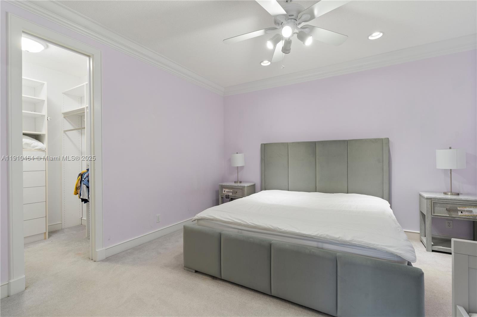 2939 Paddock Lane Weston, FL 33331 - Photo 51 of 59 a bedroom with a bed and a chandelier