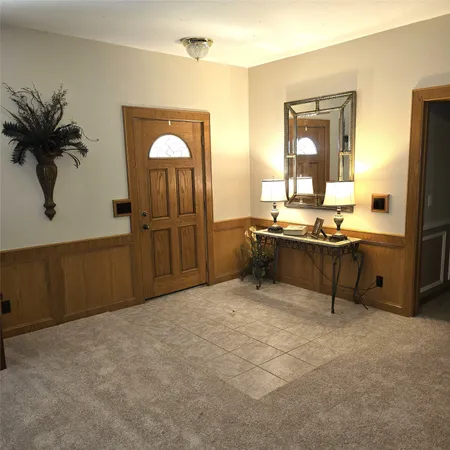 a view of a livingroom with furniture and window