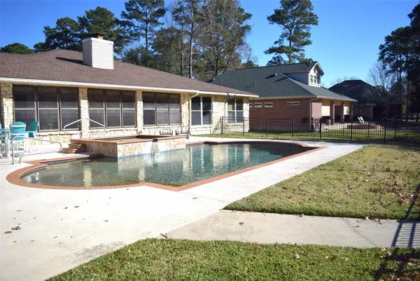 a view of house with a yard