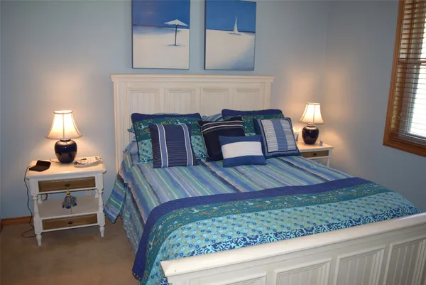 a bedroom with a bed and a fireplace