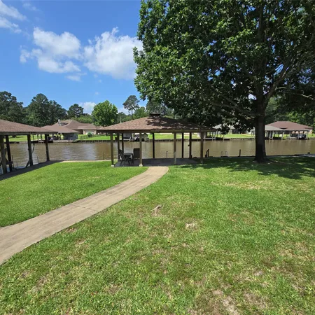a house view with swimming pool in front of it