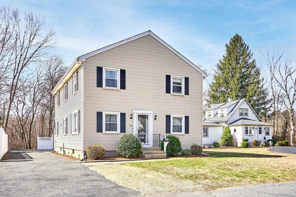 24 Washington Avenue Ashland, MA 01721 - Photo 1 of 30 a front view of a house with a yard