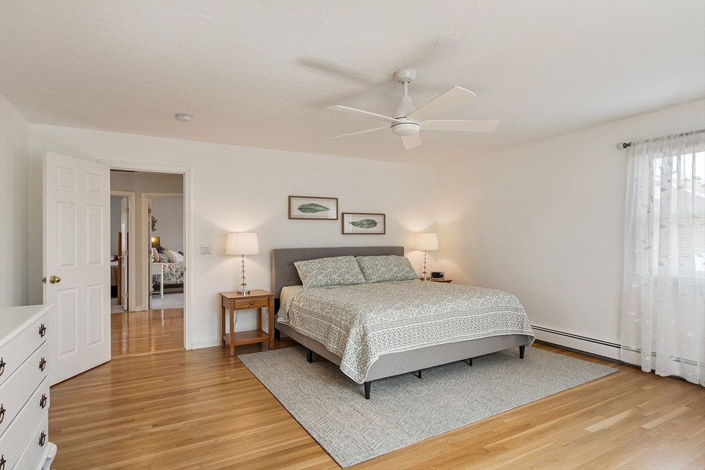 24 Washington Avenue Ashland, MA 01721 - Photo 14 of 30 a bedroom with a bed and wooden floor