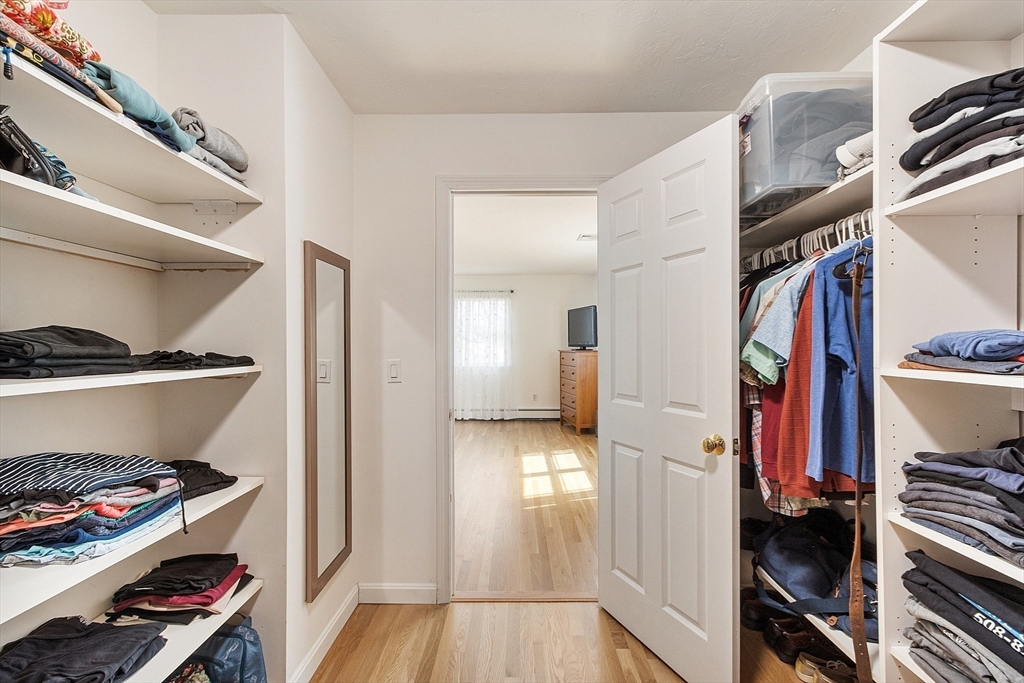 24 Washington Avenue Ashland, MA 01721 - Photo 16 of 30 a view of walk in closet with clothes and shoes