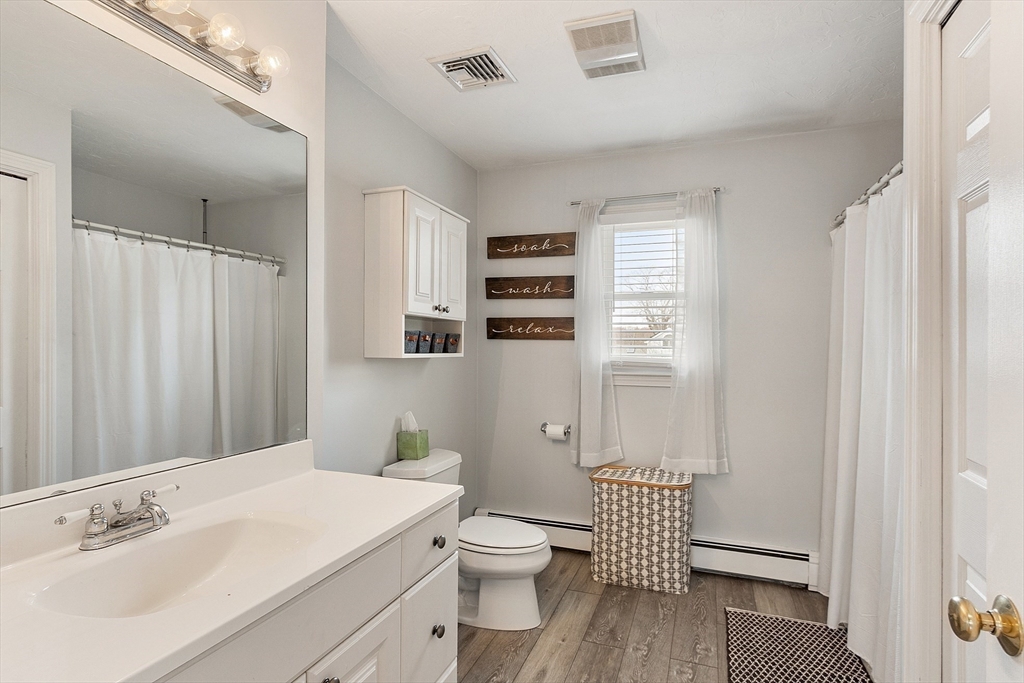 24 Washington Avenue Ashland, MA 01721 - Photo 21 of 30 a bathroom with a sink a toilet and shower