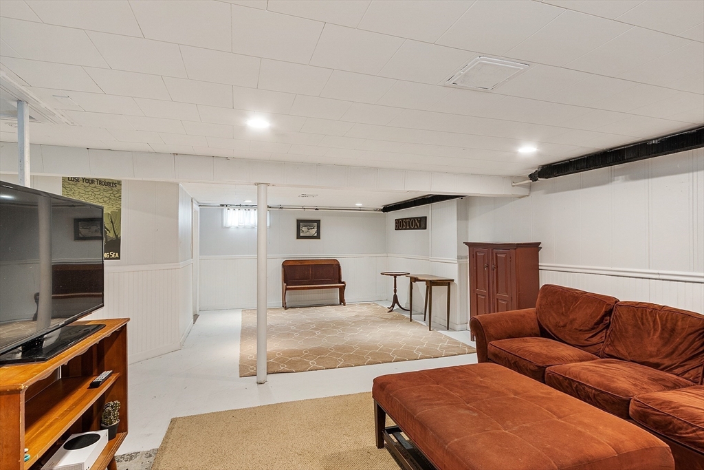 24 Washington Avenue Ashland, MA 01721 - Photo 23 of 30 a living room with furniture and a flat screen tv
