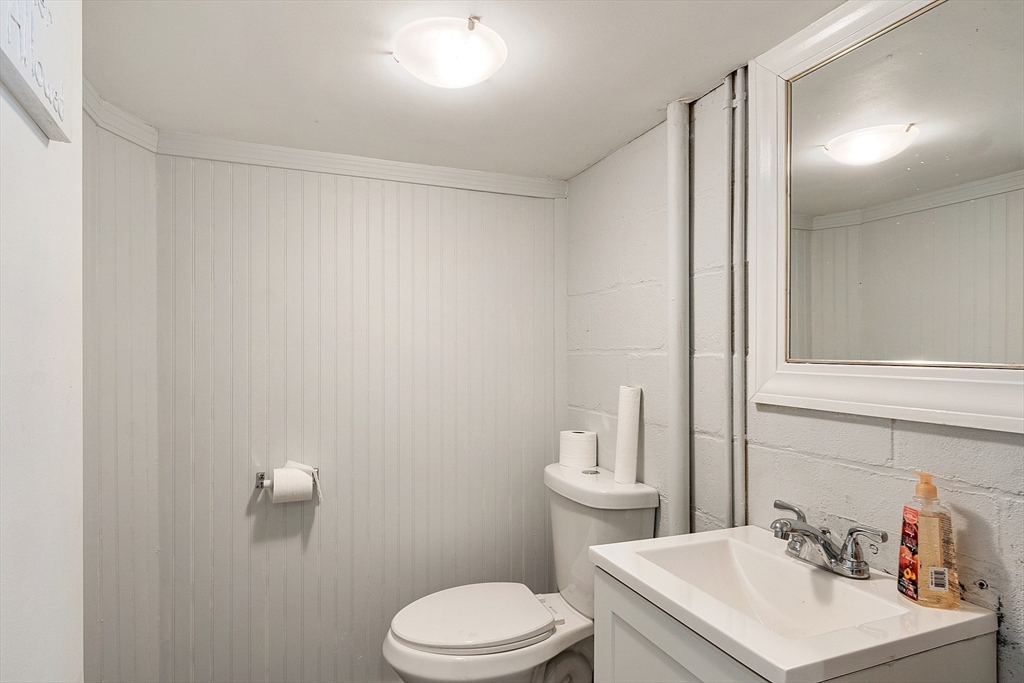 24 Washington Avenue Ashland, MA 01721 - Photo 24 of 30 a bathroom with a sink toilet and vanity