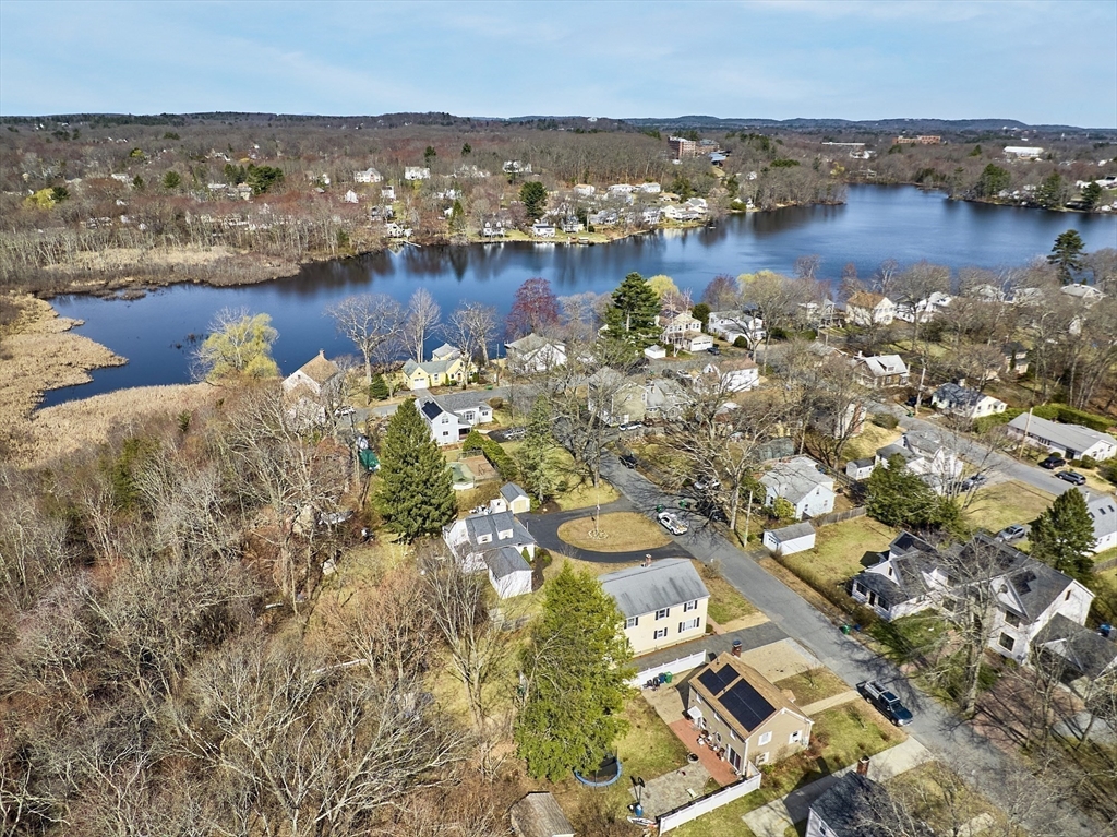 24 Washington Avenue Ashland, MA 01721 - Photo 25 of 30 an aerial view of ocean with residential house with outdoor space and trees around