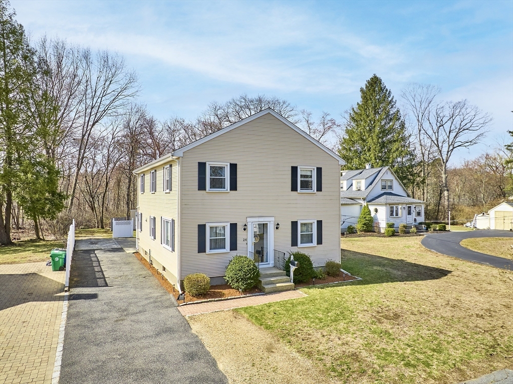 24 Washington Avenue Ashland, MA 01721 - Photo 26 of 30 front view of a house with a yard