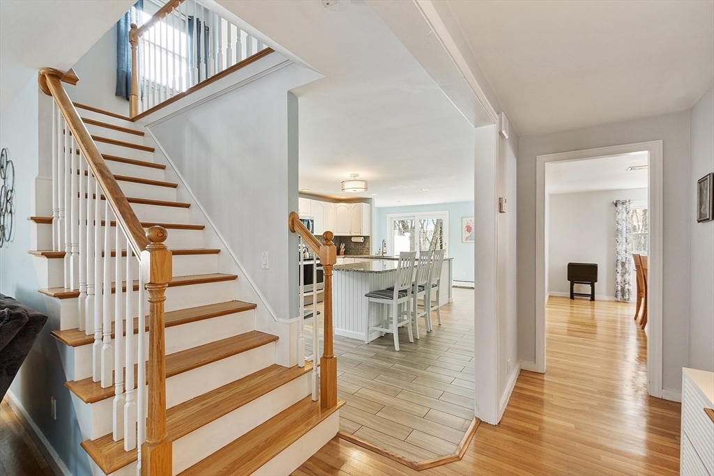 24 Washington Avenue Ashland, MA 01721 - Photo 8 of 30 a view of dining room with wooden floor and stairs
