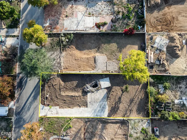a front view of a house with outdoor seating