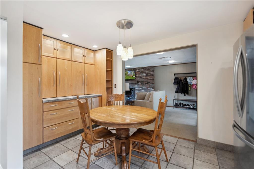 2 Lear Drive Pittsburgh, PA 15235 - Photo 14 of 43 a kitchen with stainless steel appliances refrigerator dining table and chairs