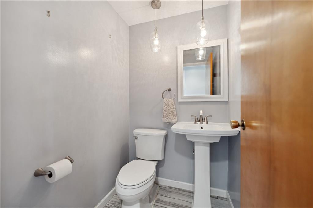 2 Lear Drive Pittsburgh, PA 15235 - Photo 21 of 43 a bathroom with a sink a toilet and mirror