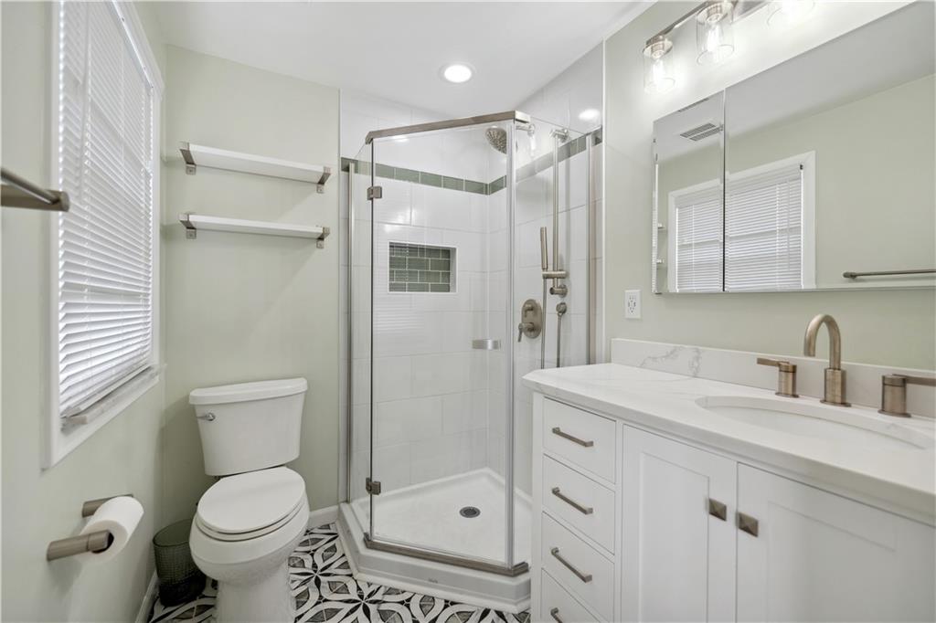 2 Lear Drive Pittsburgh, PA 15235 - Photo 25 of 43 a bathroom with a granite countertop sink toilet and shower