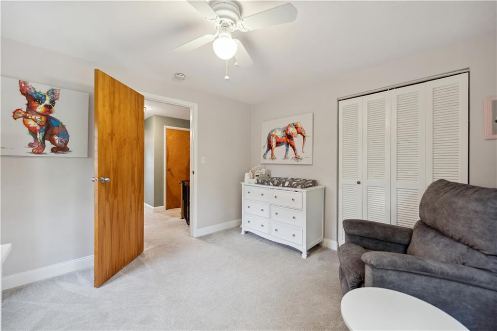 2 Lear Drive Pittsburgh, PA 15235 - Photo 29 of 43 a living room with furniture and a baby crib