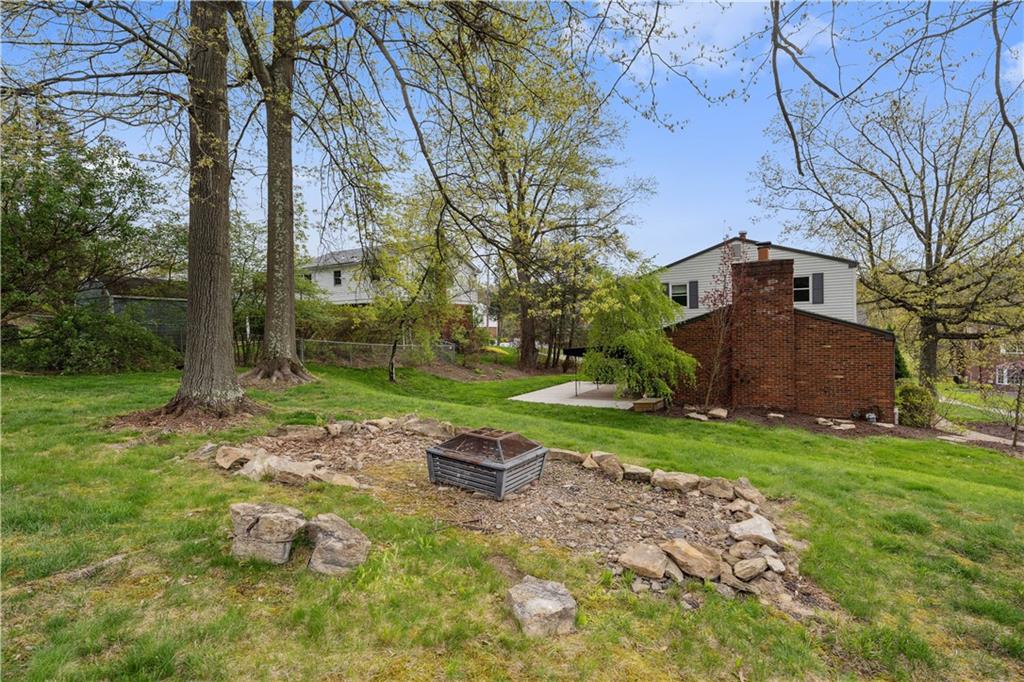 2 Lear Drive Pittsburgh, PA 15235 - Photo 3 of 43 a backyard of a house with plants and large tree