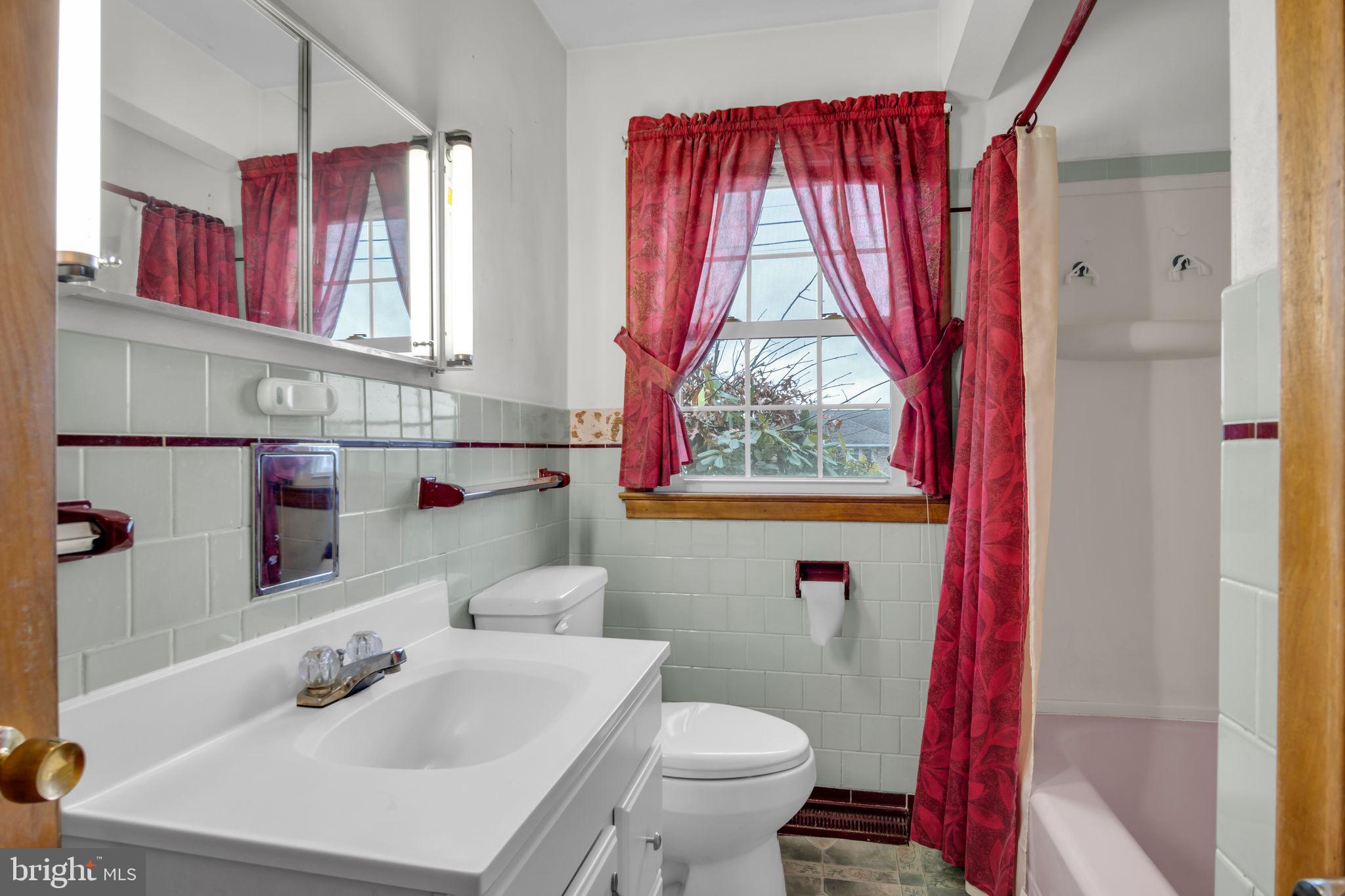 301 East Elm Avenue Hanover, PA 17331 - Photo 14 of 46 a bathroom with a sink a toilet and a window