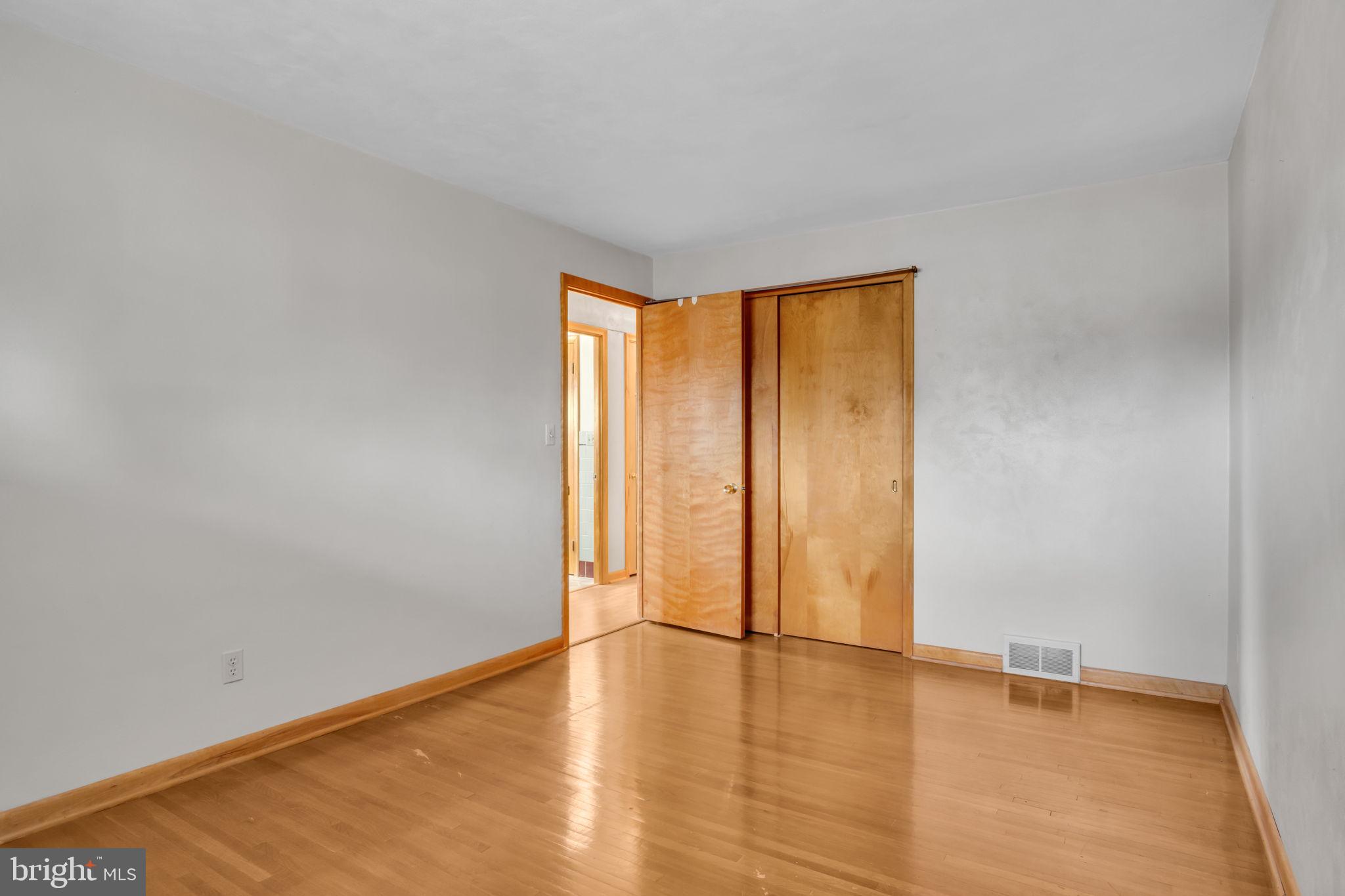 301 East Elm Avenue Hanover, PA 17331 - Photo 18 of 46 a view of an empty room with wooden floor