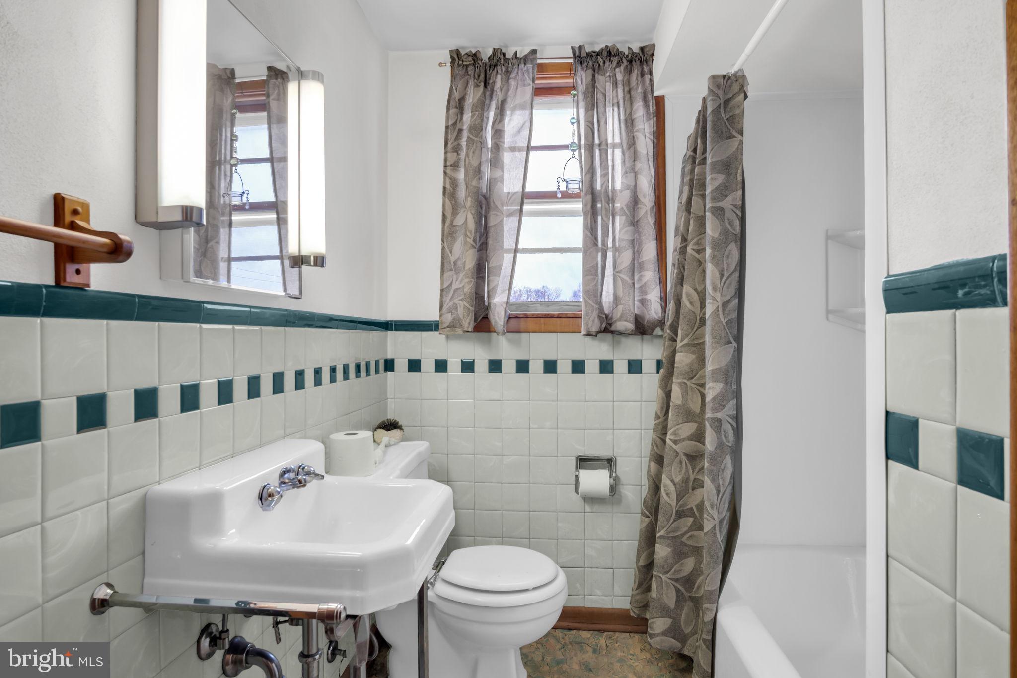 301 East Elm Avenue Hanover, PA 17331 - Photo 26 of 46 a bathroom with a sink toilet and mirror