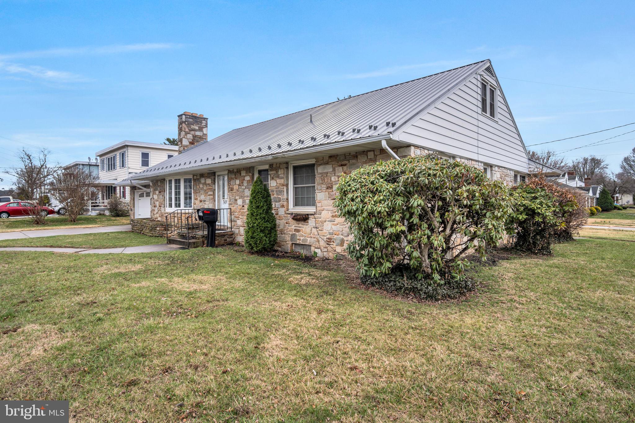 301 East Elm Avenue Hanover, PA 17331 - Photo 40 of 46 a view of a house with a yard and sitting area