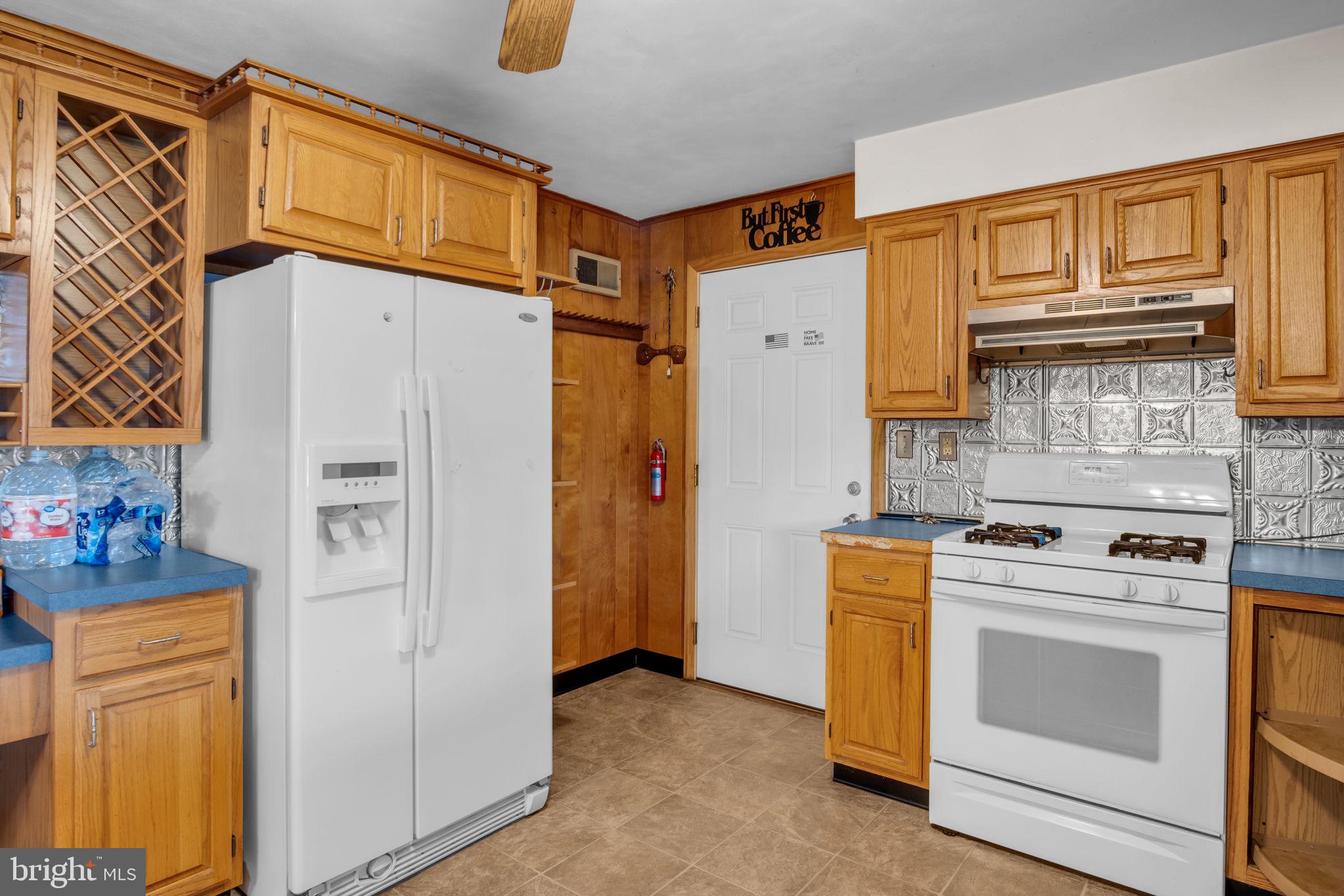 301 East Elm Avenue Hanover, PA 17331 - Photo 4 of 46 a kitchen with stainless steel appliances granite countertop a refrigerator and a stove top oven