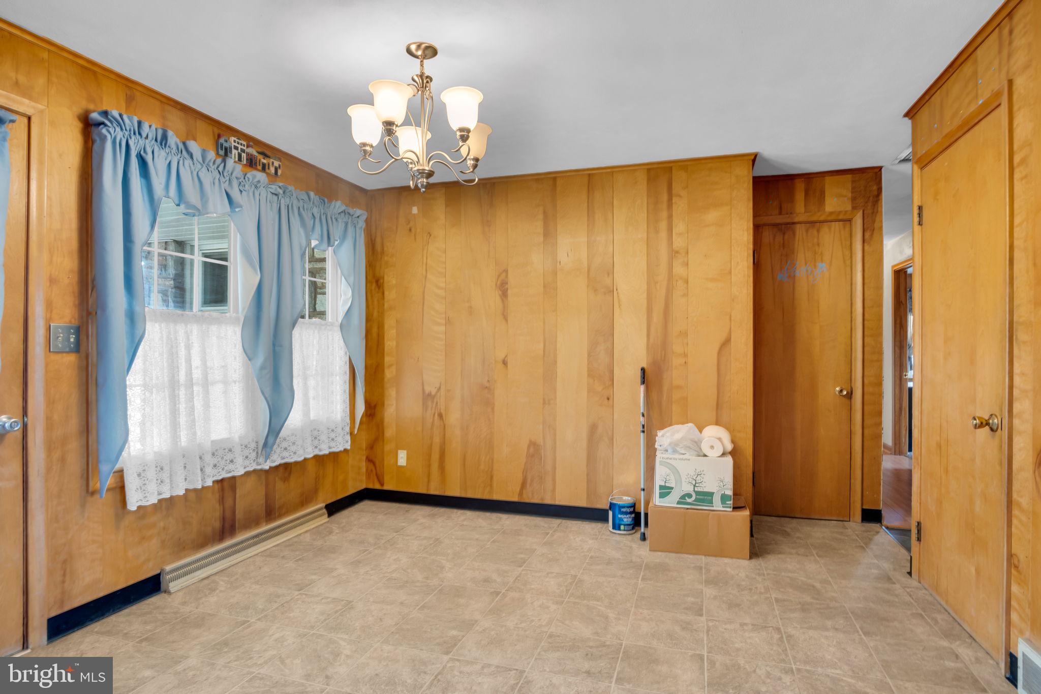 301 East Elm Avenue Hanover, PA 17331 - Photo 7 of 46 a view of a room with a door and wooden walls
