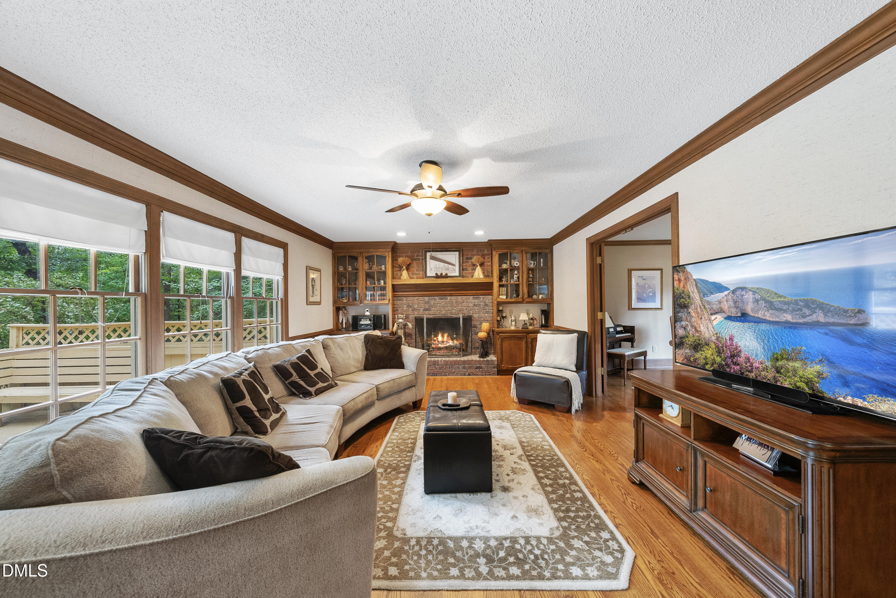 717 Misty Isle Place Raleigh, NC 27615 - Photo 19 of 59 a living room with furniture and a flat screen tv