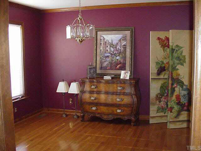 4506 Pearces Road Zebulon, NC 27597 - Photo 5 of 10 a room with furniture and a chandelier
