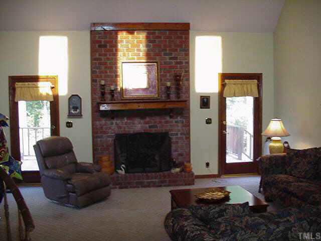 4506 Pearces Road Zebulon, NC 27597 - Photo 6 of 10 a living room with furniture and a fireplace