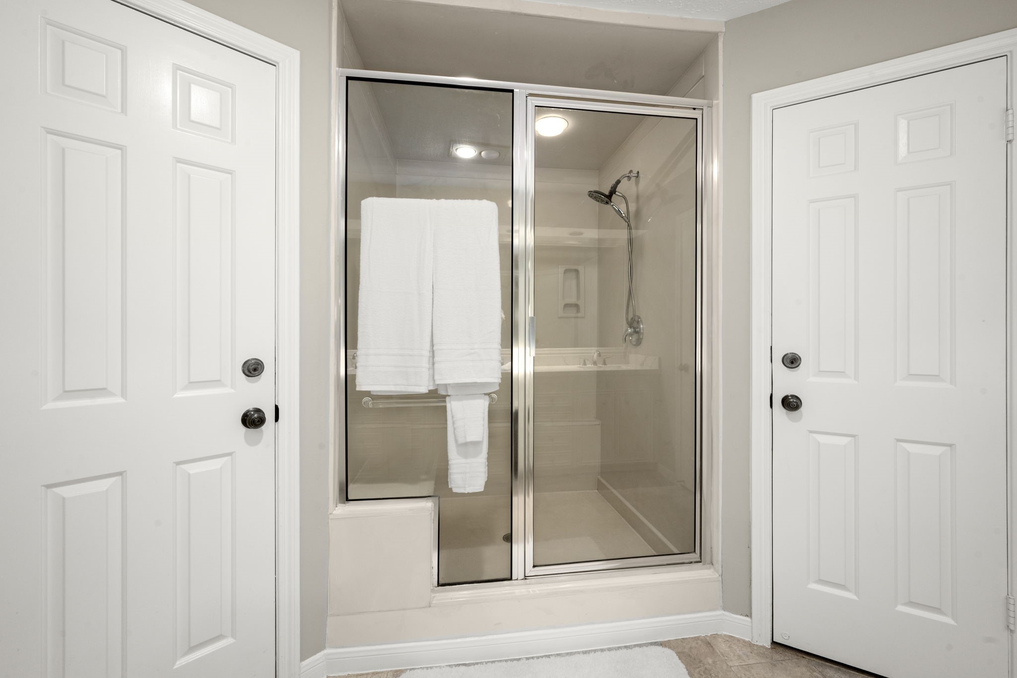16111 Maplehurst Drive Spring, TX 77379 - Photo 16 of 30 a bathroom with a glass shower door and a mirror
