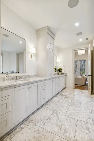 a front view of a house with a garden and yard