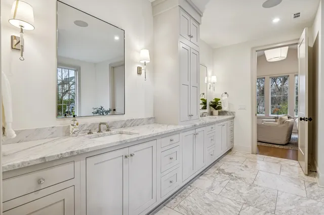 an aerial view of a house with a mountain